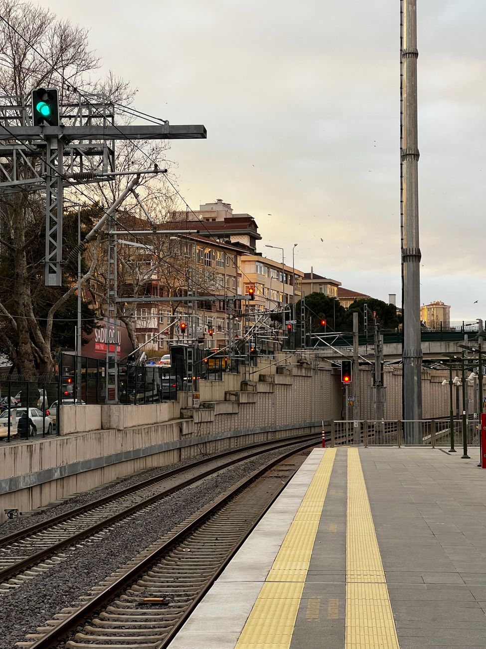 Railway tracks beside an industrial platform